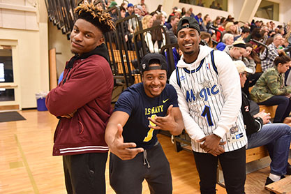 Students smiling at a sporting event. Link to Gifts of Life Insurance